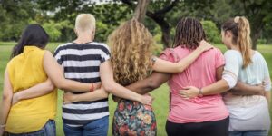 Group of women with arms around each other