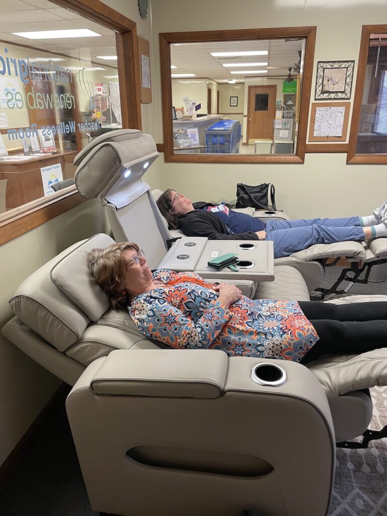 Teachers sitting on massage couch